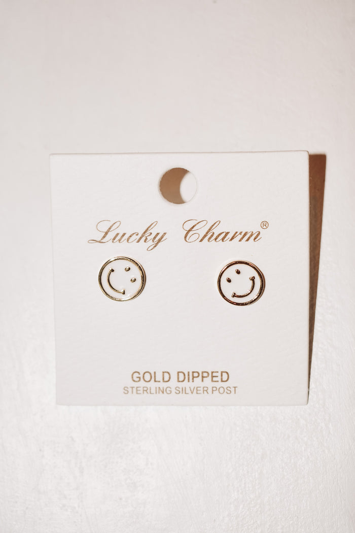 white happy face earrings 