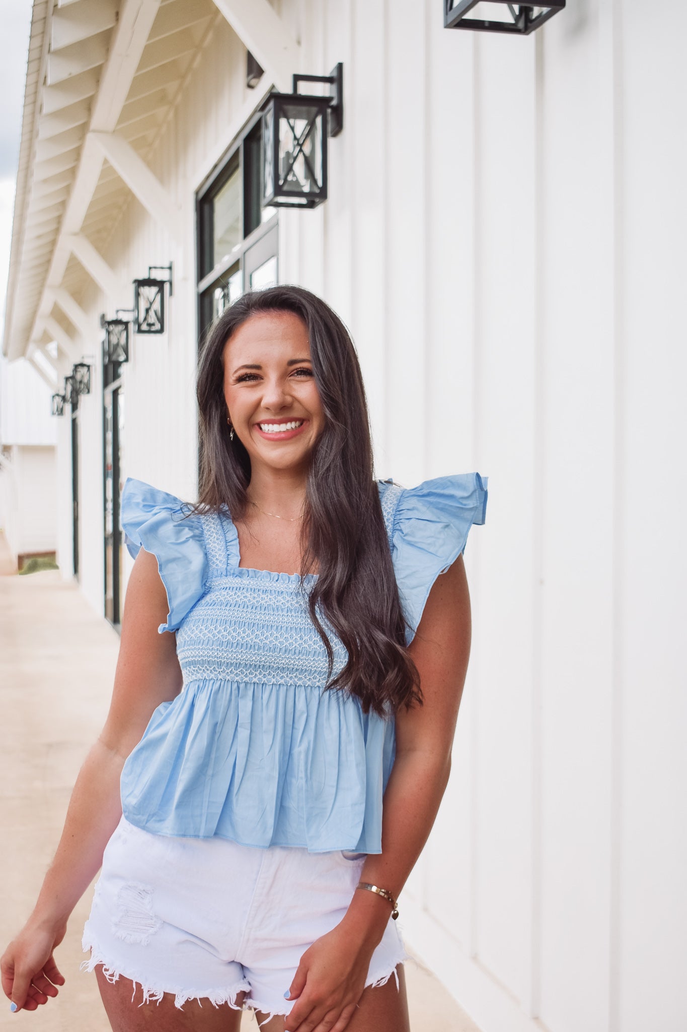 Blue and white ruffle top online